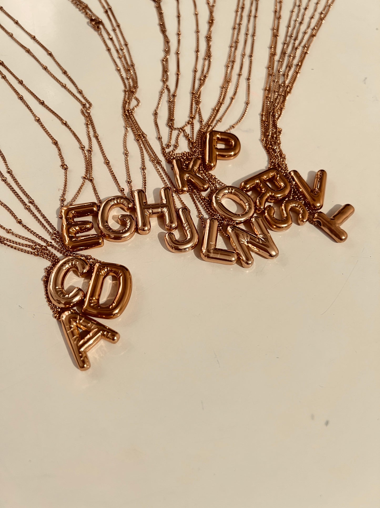 Cadena de letra en acero + Topos de balín